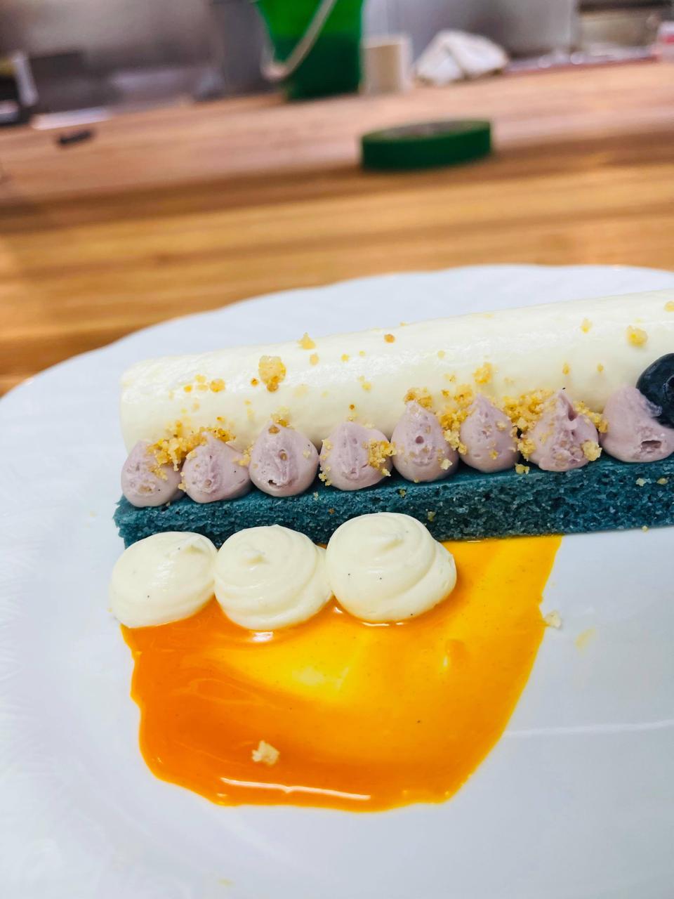 Blueberry sponge bar with vanilla mousse and fruit coulis