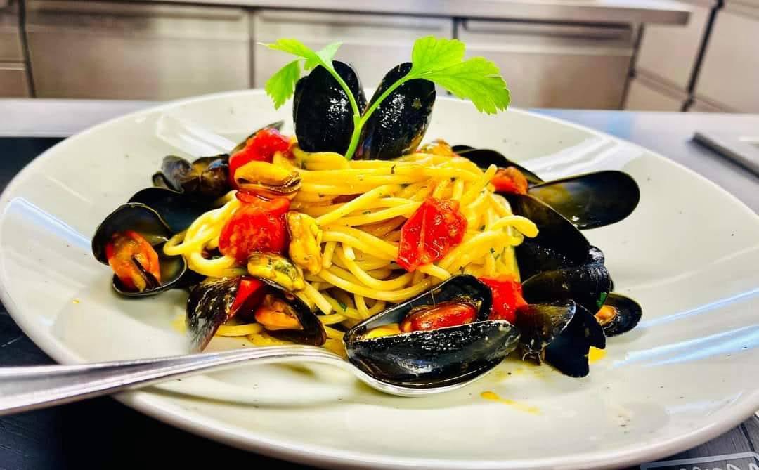 Fresh linguine tossed with black mussels and cherry tomatoes